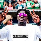 AJ Brown flashing peace signs in pink reflective LosReyes sports sunglasses