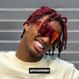 Ryan Williams smiling in Cherry Elevate reflective sunglasses with dyed hair. Perfect for showcasing athletic style and premium sports eyewear from LOSREYES.