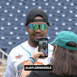 Jaylen Waddle wearing Blue raz Elevate sunglasses LosReyes at a media day.