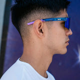 Side lifestyle view of LosReyes Prime Galaxy Neptune blue athletic sunglasses in action, showcasing secure fit, wraparound lenses, and all-day comfort