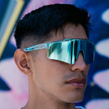 Close-up of LosReyes Prime Galaxy Uranus mirrored sports sunglasses on model, with curved blue shield lens and clear frame delivering elite protection and athletic edge.