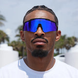 Blue-mirrored LosReyes Prime Polarized sunglasses on a basketball player – high-energy style meets court-ready durability