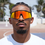 Hooper showcasing fiery orange LosReyes Prime Polarized sunglasses – ultimate performance eyewear for basketball training sessions