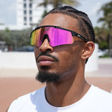 Focused streetball player styling pink lens LosReyes Prime Polarized sunglasses – vibrant sports eyewear for game day