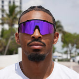 Basketball player styling purple LosReyes Prime Polarized sunglasses – sharp lens clarity for sunny training sessions