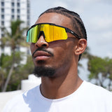 Athletic basketball player wearing yellow LosReyes Prime Polarized sunglasses – high-glare protection and luxury mirror finish for elite outdoor competition