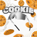 Lifestyle photo of LosReyes Prime Youth Cookie sports sunglasses with black speckled frame and silver mirrored shield lens surrounded by chocolate chip cookies and milk splash.