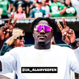 AJ Brown flashing peace signs in pink reflective LosReyes sports sunglasses