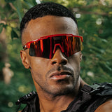 Front-facing lifestyle photo of LosReyes Prime Jurassic T-Rex sunglasses featuring a fierce red wraparound frame and mirrored shield lens, engineered for high-intensity training, outdoor performance, and aggressive UV400 protection.