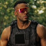 Lifestyle photo of LosReyes Prime Jurassic Triceratops sunglasses in orange and red with a mirrored shield lens and wraparound frame, worn during outdoor athletic training for bold style and full UV protection.
