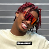 Ryan Williams smiling in Cherry Elevate reflective sunglasses with dyed hair. Perfect for showcasing athletic style and premium sports eyewear from LOSREYES.