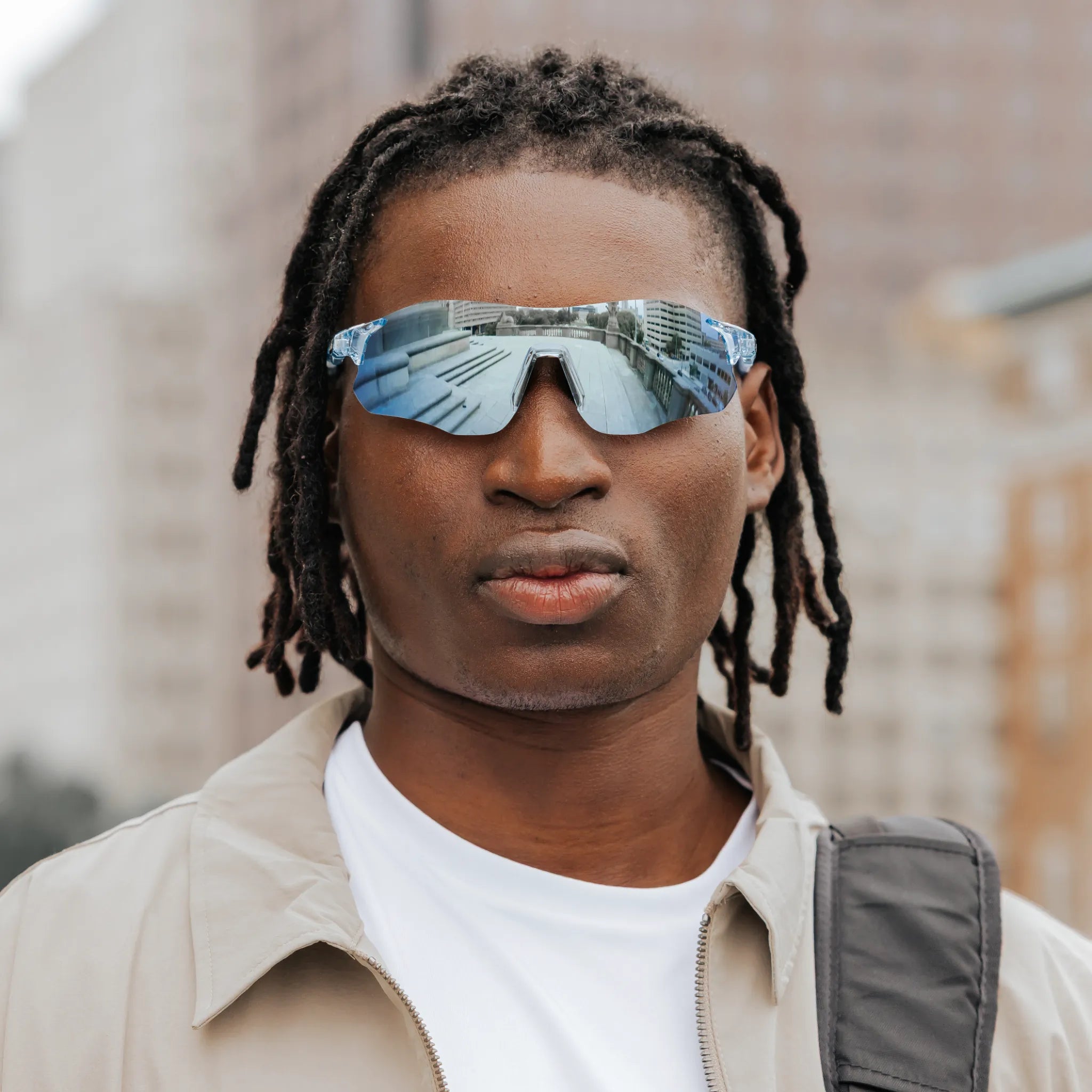Front view of model wearing Edge Ocean sunglasses with reflective blue shield lenses.