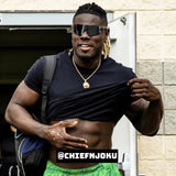 Lifestyle shot of NFL athlete Chief Njoku wearing LosReyes black mirrored wraparound athletic sunglasses post-workout, flexing in streetwear style for an outdoor fit check