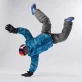 Child wearing LosReyes Everest Cream snow goggles in playful studio pose