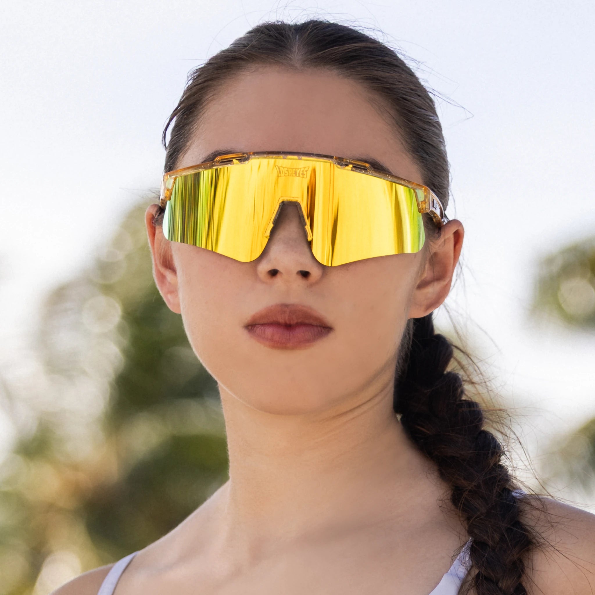 LosReyes Galaxy Prime Sun sunglasses featuring a gold mirrored lens and crystal-clear frame; sweat, scratch, and salt water-resistant performance eyewear built for running, training, and outdoor sports.