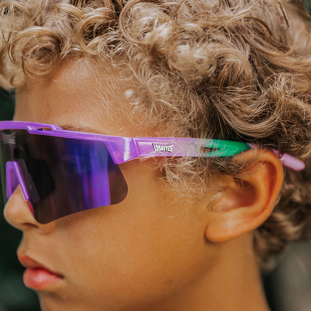 Side profile of youth wearing LosReyes Jurassic Series Brontosaurus purple sunglasses