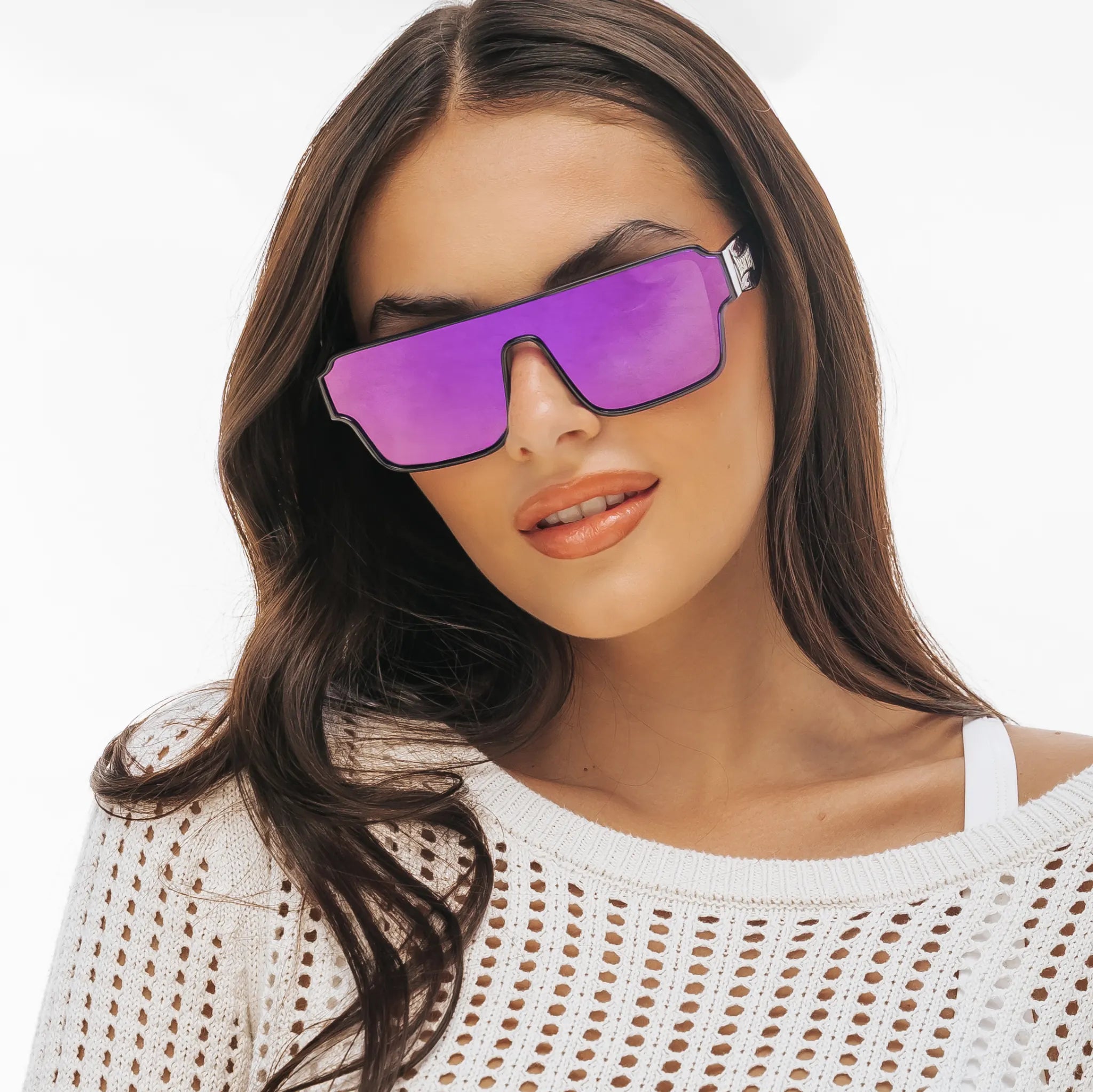 Woman wearing purple Zeus Omega sunglasses by LosReyes with a white background