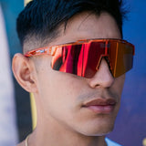 Lifestyle front view of LosReyes Prime Galaxy Mars performance sunglasses with bold red mirrored shield lens, perfect for outdoor training and streetwear versatility.