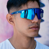 Lifestyle photo of LosReyes Prime Galaxy Neptune mirrored blue sunglasses worn by athlete outdoors, emphasizing modern performance design and UV defense