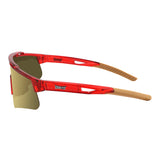 Side view of LosReyes Prime Galaxy Pluto athletic sunglasses showing transparent red frame, grippy tan arms, and mirrored UV protective lens for baseball, cycling, or training.
