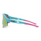 Side view of LosReyes Showtime Max Clark Reversed sunglasses in signature pink and teal colorway with mirrored shield lens and flexible arms for sport-ready comfort and style.