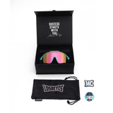 Complete LosReyes Showtime Max Clark Reversed sunglasses packaging showing custom box with motivational quote, branded case, and collectible sticker set.