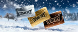 Three 'Losreyes' gift cards in different colors on a snowy background best holiday gift 